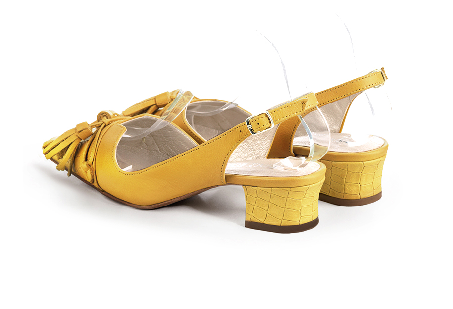 French elegance and refinement for these mustard yellow dress slingback shoes, with a knot, 
                available in many subtle leather and colour combinations. The pretty French spirit of this beautiful pump will accompany your steps nicely and comfortably.
To be personalized or not, with your materials and colors.  
                Matching clutches for parties, ceremonies and weddings.   
                You can customize these shoes to perfectly match your tastes or needs, and have a unique model.  
                Choice of leathers, colours, knots and heels. 
                Wide range of materials and shades carefully chosen.  
                Rich collection of flat, low, mid and high heels.  
                Small and large shoe sizes - Florence KOOIJMAN